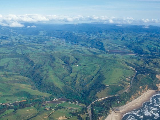 An aerial photo of the San Mateo County coast and Santa Cruz Mountains.