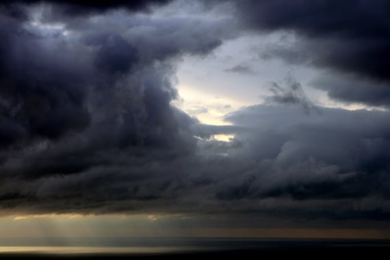 Dark storm clouds broken up by portions of light sky
