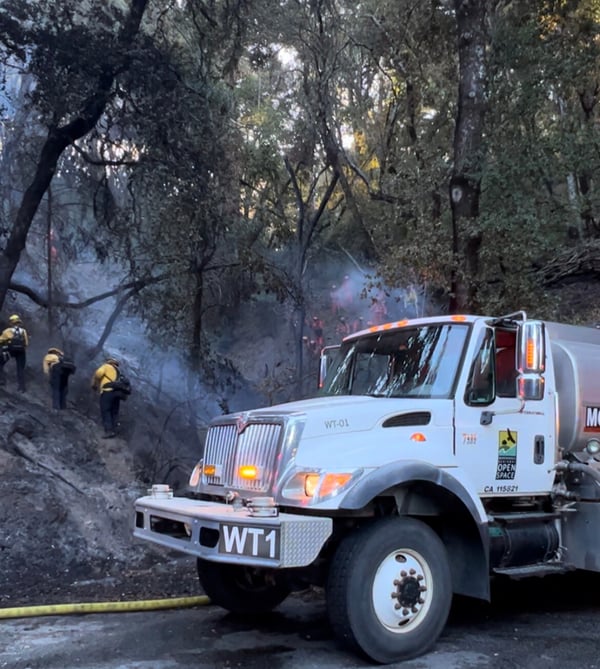 A Midpen water truck aiding fire response along Page Mill Road.